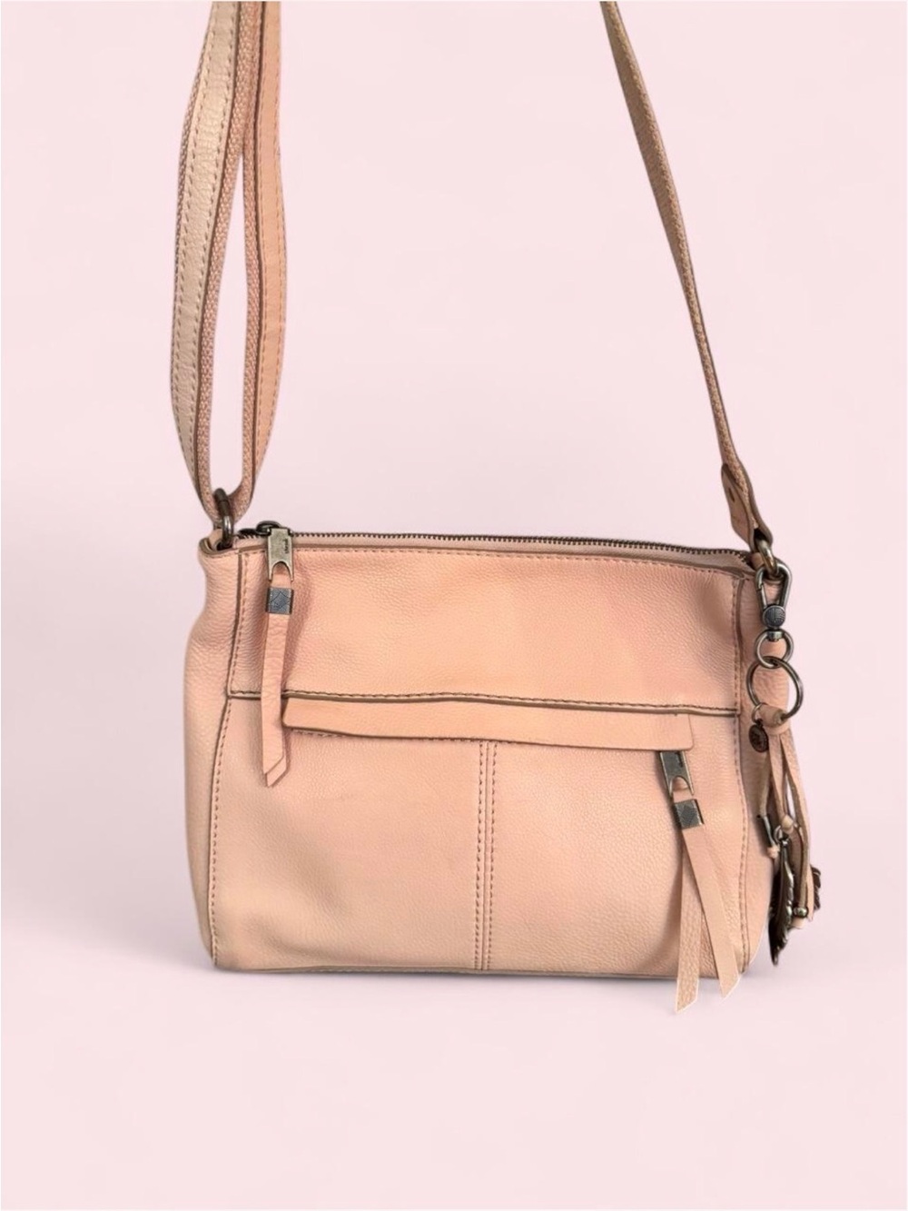 The Sak Blush Pink Pebbled Leather Crossbody with Tassel Charm